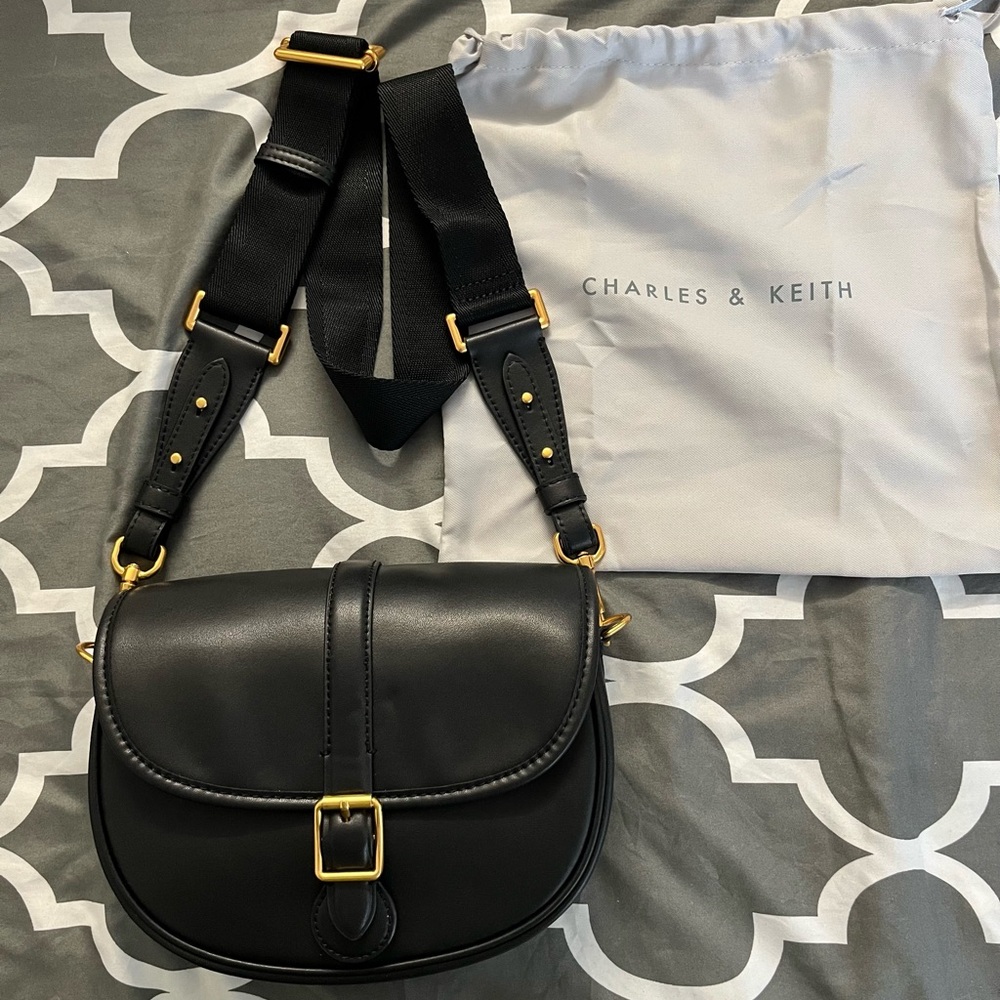 Charles & Keith Black Leather
Crossbody Bag with Gold Accents - Like
New